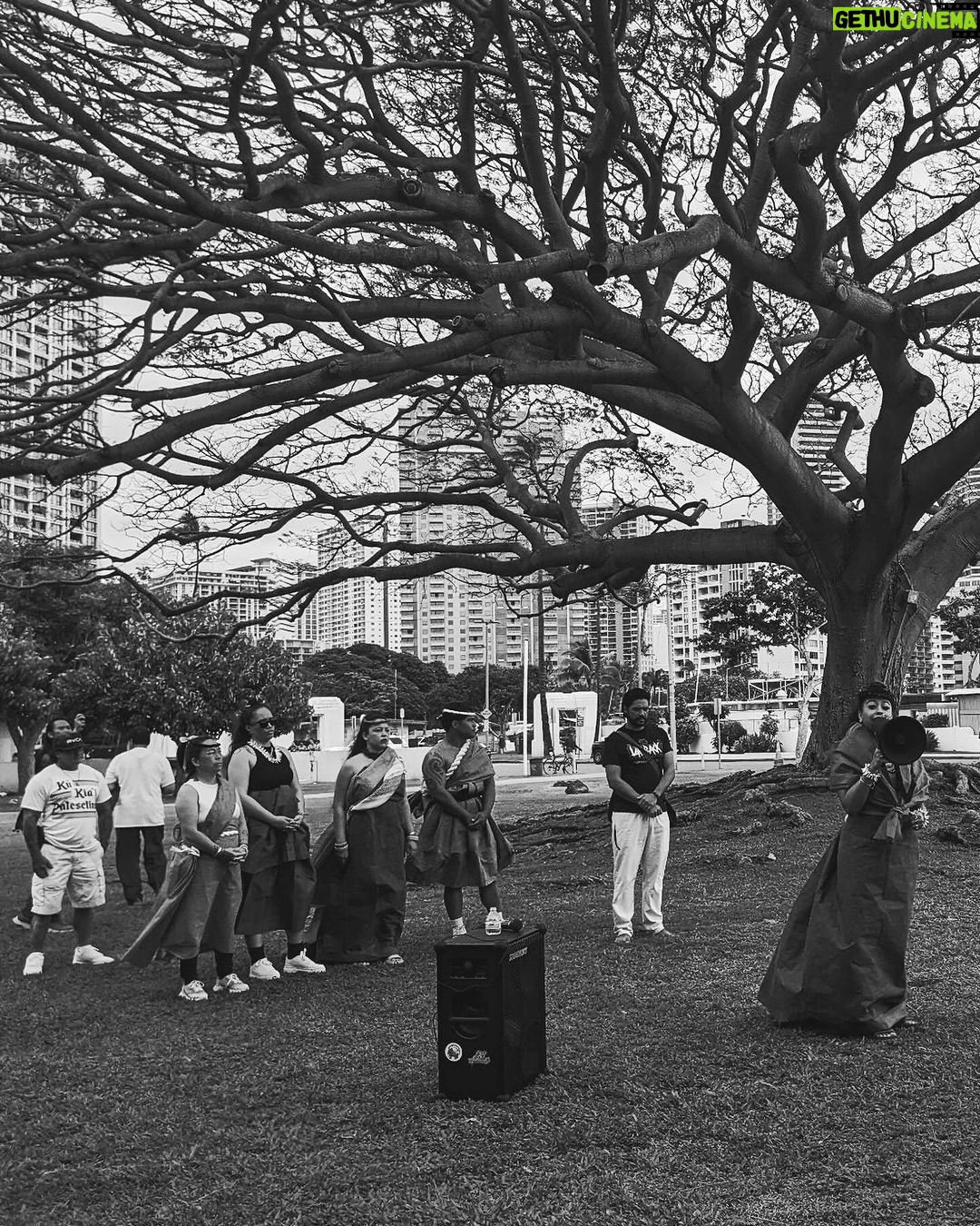 Hāwane Rios Instagram - from mauna kea to palestine we stand with you now & forever and when we say that we mean it with everything we are 🤍 pa’akai & protocols as we adorned in regalia to make offerings as we secured each pā‘ū with kākua as we placed our feathers on the summit of our heads as we tied our kīhei around of shoulders i gave thanks for all of our teachers all of our elders who showed the way who taught us that solidarity means ‘ohana who taught us that protocol is a sacred necessity who taught us that prayer is our first layer of armor oh how many times we have marched these streets chanting for justice and change for as long as i am here i will stand for what i know in my soul is pono & i will chant alongside these people right here for the rest of my days they are to me what the measure of a true aloha ‘āina really is we stood together for over a decade and now we stand together for Palestine aloha nā waipuna me nā ki‘owai o palekekina mai nā kahawai a hiki loa i ka moananuiākea e mau ke ea o ka ‘āina i ka pono i ke aloha i ka ‘oia‘i‘o kũ nā kia’i mauna a wākea kū nā kia’i palesetina ē inshallah ē to palestine, with love ‘āmama ameen 📸: @queer_kanaka 🌀
