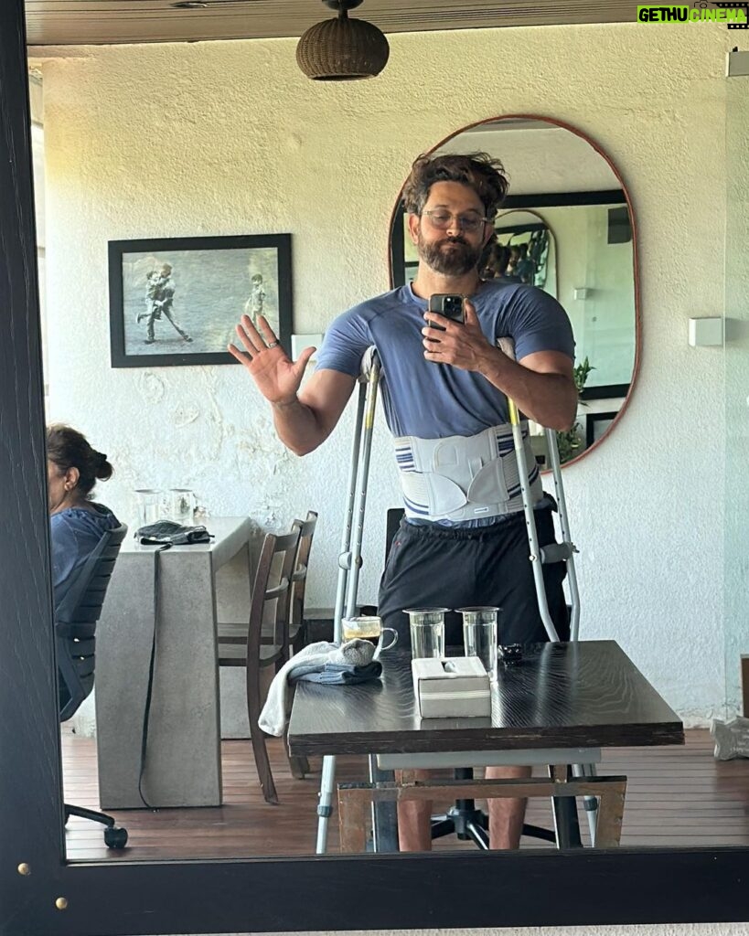 Hrithik Roshan Instagram - Good afternoon. How many of you out there ever needed to be on crutches or a wheelchair n how did that make you feel? I remember my grandfather refusing to sit on a wheelchair at the airport because it wouldn’t align with his own mental image of himself as “strong”. I remember saying “But Deda, its just an injury and nothing to do with how old you are! It will help heal the injury n not damage it further!” It made me so sad to see how strong he needed to be just to hide the fear n embarrassment on the inside. I couldn’t make sense of it. Made me feel helpless. I argued that the age factor is not applicable cause he needs the wheelchair for an injury and not his old age. He refused n kept the strong image on display for strangers (who literally didn’t care). It worsened his pain and delayed the healing. There definitely is merit in that kind of conditioning, its a virtue. It’s the mentality of a soldier. My dad comes from the same conditioning. MEN are strong. 💪 But if you say soldiers never need crutches And even when they medically do, they must refuse, just for the sake of keeping the illusion of strong intact, Then I just think that the virtue has been stretched so far that it borders on plain stupidity. I believe true strength is being relaxed , composed and fully aware that nothing, not crutches, not a wheelchair, not any inability or vulnerability - and certainly not any sitting position can lessen or alter the image of that GIANT that you are on the inside. Strength is not always being Rambo against all odds with a machine gun saying “fuck em!” That’s applicable sure . Sometimes. And it’s the kind we all aspire for. Even me. But the more coveted one is strength when there is no one to fight on the outside. It’s that quiet fight on the inside between you and the “image” of you. If you come out of that one feeling like wanting to do a slow dance by yourself , then you’re my hero. Anyways, pulled a muscle yesterday woke up wanting to reach out about this notion of strength. This is ofcourse a bigger conversation , the crutches is just a metaphor. If you get it, you get it. #beagiant #giantsdontgiveashit #strengthisgraceful