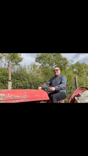 Hugh Wallace Instagram - I’m filming this week and thought I’d take this tractor for a spin! 
Not sure I have the correct footwear for the job! 
#farminglife #irisharchitect