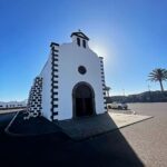 Hugh Wallace Instagram - Today we visited Ermita de Los Dolores, (Our lady of Sorrows) a modest 18th-century church with a rich history. The church has a single nave built in white stonework with black volcanic details. Its façade is crowned by a double gap belfry that serves as a bell tower, with a semi-circular arch across its entrance together with a small translucent oculus. All of this is presided over by a Catholic cross. Its most prominent element is its half-orange dome with a skylight in the centre. When I’m on holidays I love to visit places of interest, any other suggestions? #lanzarote #architecture Lanzarote, Canary Islands