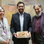 Humza Yousaf Instagram - Thanks to Ephraim and Margalit from the Scottish Council of Jewish Communities for bringing Giffnock's finest sufganiyah to @scotparl today, as #Hanukkah, the Jewish Festival of Lights, gets underway. A reminder, in spite of the darkness of recent times, of the power of light and of hope. Chag urim sameach! Scottish Parliament