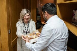 Humza Yousaf Instagram - Thanks to Ephraim and Margalit from the Scottish Council of Jewish Communities for bringing Giffnock's finest sufganiyah to @scotparl today, as #Hanukkah, the Jewish Festival of Lights, gets underway.

A reminder, in spite of the darkness of recent times, of the power of light and of hope.

Chag urim sameach!