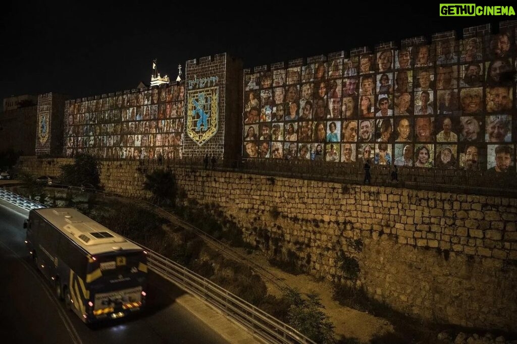 Ian Bremmer Instagram - the faces of those kidnapped by hamas projected onto outer wall in old city of jerusalem