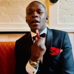 Israel Adesanya Instagram - 🃏 “The Rose that grew from concrete.” - Tupac Shakur 🥀 Did you hear about the rose that grew from a crack in the concrete? Proving nature's law is wrong it learned to walk with out having feet. Funny it seems, but by keeping it's dreams, it learned to breathe fresh air. Long live the rose that grew from concrete when no one else ever cared. @ugomozie ❌ @stylebender 🌹✨