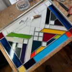 Ivy Winters Instagram - Hello everyone! I hope everyone has been staying happy and healthy this winter season!I’ve been pretty busy making stained glass panels and wanted to share with you my latest commission piece. It’s 31” by 21” with a fun range of colors, textures and square bevels. It has been recently installed in my clients laundry room (last picture). #stainedglass #leadwindow #lead #glass #glasscutter #beveledglass #art #window #handmade