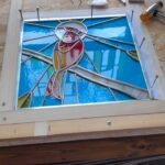 Ivy Winters Instagram - A cardinal panel I created for my cousin ❤️ I enjoyed making this piece for her. I included a little video of the cementing process. It was a breezy cold day and my wind-chimes were just a singing ❤️ #cardinal #stainedglass #leadedwindow #cement #windchimes