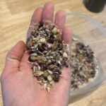 Ivy Winters Instagram - This is what 3,000 garlic cloves looks like!After breaking the bulbs apart they get a vodka / alcohol rinse as well as a 3 day bath in fish emulsion. It’s a good idea to sterilize the cloves before planting as well as give them some food before winter. I also made a new dibbler tool to help with spacing and planting. Saved a lot on the back! They then got a nice layer of pine shavings to help insulate them for their long winter nap. The last photo is the garlic bulbils I saved from the dried garlic flowers. It’ll take a few years for these little bulbils to mature into nice big bulbs. Happy garlic growing friends! #garlic #hardneck #michigan #garden #homogrown #fishfertalizer #diy #stinkyflower #cloves #bulbils #dibbler #innovative