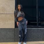 Izzy Fairthorne Instagram - If I can’t wear a tracksuit I’m not coming Fit is @FashionNova 🖤 ad