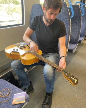 Jack Broadbent Instagram - Changin’ my strings on the train to London. @daddarioandco thanks so much for keeping me rocking. Trying some 11’s tonight instead of my usual 12’s or 13’s. What strings do you guys use out there? Peace, Jack ✌️Catch my last European tour date tonight at the @thejazzcafe Camden Town. Some tickets still available #daddario #guitarstrings #jackbroadbent