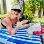 Jane Hall Instagram - Greetings from the Bali pool deck. Hydration tip for the day… icy cold coconut water with a splash (or a heavy pour) of your favourite vodka. No judgement. Thank me later. Also, @pippamitchell_ your @seafollyaustralia sarong is working HARD.