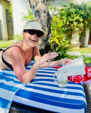 Jane Hall Instagram - Greetings from the Bali pool deck. Hydration tip for the day… icy cold coconut water with a splash (or a heavy pour) of your favourite vodka. No judgement.
Thank me later.
Also, @pippamitchell_ your @seafollyaustralia sarong is working HARD.