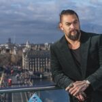 Jason Momoa Instagram – @prideofgypsies @aquamanmovie in @henrypooleco suit and @iwcwatches #iwcschaffhausen #rosegold