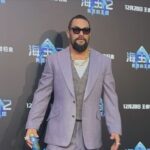 Jason Momoa Instagram – @prideofgypsies @aquamanmovie in @henrypooleco suit and @iwcwatches #iwcschaffhausen #rosegold