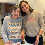 Jennifer Garner Instagram - #PretendCookingShow: Chiffon Pie. 🍓🥧🍑 #KitchenAidAmbassador Summertime for the Garner Girls: there was always a garden. Farmers markets were king. We ate dinner on the deck my dad built. And for dessert, we had mom’s chiffon pie. ☀️🥧 Mom’s pie had an irresistible crunch:chew ratio. Just sweet enough, not a bit more. And the filling—peaked whipped cream with berries and/or whatever stone fruit smelled fresh at the fruit stand—absolute summer heaven. Perfect for company, but with middle-of-the-week ease, this Southern Living standard felt just right for a Pretend Cooking Show with Pat Garner. My work with @kitchenaidusa comes honestly—everything from mom’s kitchen was mixed with a KitchenAid hand mixer, and it’s still true today. Case in point: beaten egg whites and whipped cream for your new favorite dessert. Let me know how it goes! #ad Peach Chiffon Pie from Southern Living Cookbook, 1989 Courtesy of Mrs. Clifford B. Smith, Sr.— White Hall, Maryland Ingredients: - 3 egg whites - 1 cup sugar - ⅔ cup saltine cracker crumbs - ¼ tsp baking powder - ½ cup chopped pecans - 1 tsp vanilla extract - 1 cup whipping cream - 2 Tbsp sugar - 2 cups sliced fresh peaches (~1 lb) . Directions: 1. Preheat oven to 325°. 2. Beat egg whites (at room temperature) at high speed of an electric mixer until foamy. 3. Gradually add 1 cup sugar, 2 tablespoons at a time, beating until stiff peaks form. 4. Fold in cracker crumbs, baking powder, pecans, and vanilla. 5. Spoon meringue mixture into a buttered 9 inch pie plate. Bake for 30 minutes. Let cool. 6. Meanwhile, beat whipping cream at high speed until foamy; gradually add 2 tablespoons sugar, beating until soft peaks form. 7. Fold in sliced peaches and spoon evenly over meringue crust. 8. Chill pie until ready to serve. 9. Yum.