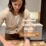 Jennifer Garner Instagram - #PretendCookingShow: Cloud Cookies 🍪. #KitchenAidAmbassador In the season of sugar cookies and candy canes, sometimes you just want a chocolate chip cookie. A very special one. A cloud-like wonder of a chocolate chip cookie. ☁️♥️☁️ Whether you’re gathered around the fire with family, or in the kitchen with a developing spray tan 😉🫠 (😘 @thechocolatesun) — just don’t forget the superfine sugar! 🙈😂 #ad . Cloud Cookies by @sarabethsnyc Ingredients: - 1 ⅓ cup superfine sugar - 1 ⅓ cup packed light brown sugar - 1 cup (2 sticks) unsalted butter, at room temp, cut into ½ in cubes - 2 large eggs, at room temp, beaten - 2 cups unbleached all-purpose flour - ¾ tsp baking soda - ¼ tsp fine sea salt - 2 cups toasted sliced almonds - 2 cups chocolate chips . Directions: 1. Position racks in center and top third of oven and preheat to 350°. Line three half-sheet pans with parchment paper. 2. Rub sugar and brown sugar together through a coarse wire-mesh sieve into a medium bowl; set aside. (You can use your @kitchenaidusa Sifter + Scale attachment here on white sugar!) 3. Beat butter in the bowl of your KitchenAid 7 Qt Bowl Lift Stand Mixer fitted with the paddle attachment on high speed until smooth, ~1 min. Gradually add sugar mixture, then vanilla. Beat, occasionally scraping the bottom/sides of the bowl, until mixture is pale yellow and light textured, ~5 mins. Gradually beat in eggs. 4. Sift flour, baking soda & salt together into a medium bowl. With mixer on low, add dry ingredients mixing just until each addition is incorporated. Add almonds and chocolate chips and mix until just combined. 5. Using a 2 inch diameter ice cream scoop, portion the batter onto the prepared pans and slightly flatten each ball of dough. Bake two of the pans of cookies, switching position of the pans from top to bottom and front to back about halfway through baking, until cookies are evenly golden brown, ~15-18 mins. During the last 3 mins, rap each pan on the rack. The cookies will deflate and their signature cracks will appear on the tops. Repeat with third pan. Cool on pans. 6. Yum!