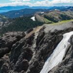 Jeremy Jones Instagram – “I saw a couple nice lines” @mia__jones_ said after a recent summer hike. 
It’s all I needed to hear to fire up the bikes and take a look. 
I must admit I was skeptical looking up from the valley at the bare mountains that we would make turns but she was right. 
Wild flowers, single track and late August turns on some of my favorite lines made for a memorable day. 
Extra grateful to get a bonus day of summer shralpinism with her before she heads to college! 

📷 @ming.t.poon 
@iamspecialized_mtb
#snowpatchhunters