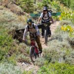 Jeremy Jones Instagram – “I saw a couple nice lines” @mia__jones_ said after a recent summer hike.
It’s all I needed to hear to fire up the bikes and take a look.
I must admit I was skeptical looking up from the valley at the bare mountains that we would make turns but she was right.
Wild flowers, single track and late August turns on some of my favorite lines made for a memorable day.
Extra grateful to get a bonus day of summer shralpinism with her before she heads to college!
📷 @ming.t.poon
@iamspecialized_mtb
#snowpatchhunters