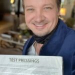 Jeremy Renner Instagram - VINYL TEST PRESSED… and passed ! What started as a crushing accident , turned emotional score of recovery , has NOW become a tangible beacon of the experience of life, death, recovery , and all things learned along the way. I hope you enjoy Thank you for all the love and support as I’ve needed all of it to get through. And I’m blessed to be able to share this journey with you 🙏🏼❤️‍🔥 #loveandtitanium