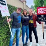 Jes Macallan Instagram - Literally, four weeks postpartum, to the day, @mrnicbishop and I had our first big outing away from baby. We chose to join our beloved friends and colleagues (also supported by our amazing “fanmily” with an ice cream truck 🤯, thank you from the bottom of my, just had a baby, heart). I had so much love in my body that day because it was also a mini reunion with so many people I love so hard, from a project that has meant so much to me for so long. At eight weeks postpartum, we took our little man for his first big outing to meet some more tv family that I love dearly and hold close to my heart. Here we are today… officially on strike. We stand by @sagaftra and our sister unions as a family. The future is… well, unclear. Warner Brother Studios
