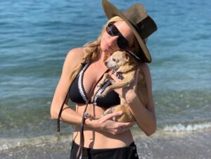 Jes Macallan Instagram - To my beautiful, courageous, little lion heart. My little “pow pow”. My Baci bean. My little Choochy. My Bacini weeny. My best friend. It has been 12 days, 2 hours, and 7 minutes since you took your last breath in my arms. My heart is completely broken and I am lost without you. The only solace and strength I hold onto was that you lived an amazing life and we had a hell of an amazing adventure together. From the moment I saw you as a teeny tiny 8 week old puppy at that flea market in the trunk of that horrible persons car in Milan, Italy... I took you from him and promised I would protect you and take care of you until your very last breath. I had no money and no plan... but I knew we could get through anything if we had each other. Who knew that you would be the one that ended up protecting me. Some EIGHTEEN YEARS later here you were, wise but weak after all of our adventures together... after all of our moves, career changes, life changes, relationship changes, heartbreaks, hardships, wins and losses, celebrations and successes and all the laughter and kisses and cuddles... you told me you were ready to cross the rainbow bridge. So we went to the beach, we went to your favorite river, we laid in the sun, you slept in my arms, and we ate cheeseburgers and turkey sandwiches till we burst. As I knew you would... you fought till the end... but your little body couldn’t keep up with your giant heart. Thank you for letting me be your person and for teaching  me all of the things you did.  You touched so many people and it feels as though a giant book of chapters and chapters of my life has closed. I promise to keep growing and learning and to keep the same promise for your furry brother and sister. They will be safe until their last breath. You are my hero and you were a warrior... my darling little Baci. 
Ci vediamo dopo amore mio. Ti amo per sempre. I love you always. #heartbroken #smilingthroughtears #furevermybestfriend #mygirl #womansbestfriend #runandplayfreeofpainontherainbowbridge #Bacibean