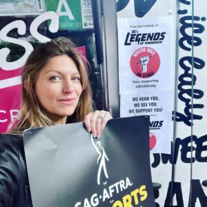 Jes Macallan Instagram - Literally, four weeks postpartum, to the day, @mrnicbishop and I had our first big outing away from baby. 

We chose to join our beloved friends and colleagues (also supported by our amazing “fanmily” with an ice cream truck 🤯, thank you from the bottom of my, just had a baby, heart). I had so much love in my body that day because it was also a mini reunion with so many people I love so hard, from a project that has meant so much to me for so long. 

At eight weeks postpartum, we took our little man for his first big outing to meet some more tv family that I love dearly and hold close to my heart. 

Here we are today… officially on strike. We stand by @sagaftra and our sister unions as a family. The future is… well, unclear.