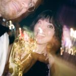Jessica Lu Instagram – Incredibly proud of my husband. Also incredibly overwhelmed with feelings. Admittedly I haven’t finished watching S3 of Atlanta but I know it’s wacky, weird, unforgettable, filled to the brim with hard work and talent all across the board. I remember being so pregnant, my morning sickness surpassing the 3 month mark, not knowing it would last up until the point I gave birth. I remember my mom getting diagnosed with a terminal illness in the middle of it. My husband was supposed to leave for Europe to finally start filming what the pandemic had delayed. And then miraculously he stayed. He helped them find another DP to take over his European episodes, and he stayed with me as I sobbed and grieved and threw up and eventually gave birth to this sweet daughter of ours. When we were five weeks into transition he had to leave for Atlanta to take over the rest of his filming duties and I stayed home, taking care of our newborn and my mother, sleep deprivation taking its toll and my hallucinations fighting to win. That’s what I think about when I think of Atlanta S3, is pain, heartbreak, death, loneliness, endless worrying, rage, but also resilience, hope, recovery. I told him that if he were to get nominated again, and if he were to win, he better thank me first because last time he thanked me last, and the music was already playing him out and nobody heard him profess his undying love for me.