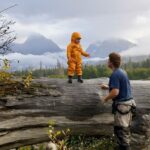 Jim Baird Instagram - New video up! (Link in bio.). In this one, @torigoesoutside and I continue down Northern BC’s Stikine River towards Alaska with our family. We camp in a couple nice places where we need to put our tarp to good use because of the rain. Breaking camp in the morning takes a lot more time with kids as they need to be fed and dressed, (you can see me putting on Wesley’s wet suit on in one of the pics here). Both adults can’t really work at camp tasks at the same time because one of us needs to keep a watchful eye on our son Hudson who likes to go for hikes (with or without us!). Things get more challenging when we’re traveling down river and the rain really picks up…it just won’t let up for hours and hours on end and we’re soaked. Come evening, we begin searching for a cabin that should be close by. Our river notes are 30 years old so we don’t really know if it’s even there anymore. Soaked to the bone, at this point we’d be very grateful for a place to get warm and dry out tons of wet cloths. Do we find it? #alaska #jbadventurer #stikineriver #canoetrip #familycamping #outdoors #campwithkids #wilderness