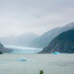 Jim Baird Instagram - Despite more rain, it was an incredible day on the Stikine River. We portaged the canoe over a mile to get into a remote lake only accessible by plane or boat. We paddled by mesmerizing icebergs and were in awe of the glaciers around the lake. In episode 12 of our adventure, @torigoesoutside and I finally paddled into Alaska, and found an off-grid salmon processing facility. Did we manage to get some fresh Stikine River sockeye salmon? Check out episode 12 of our adventure series on YouTube - link in bio! #outdoors #canoeing #alaskaadventures #northernbc #camping #familycamping #stikineriver #greatglscier #mountainsadventure #campingintherain