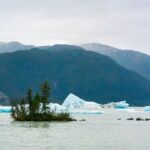 Jim Baird Instagram - Despite more rain, it was an incredible day on the Stikine River. We portaged the canoe over a mile to get into a remote lake only accessible by plane or boat. We paddled by mesmerizing icebergs and were in awe of the glaciers around the lake. In episode 12 of our adventure, @torigoesoutside and I finally paddled into Alaska, and found an off-grid salmon processing facility. Did we manage to get some fresh Stikine River sockeye salmon? Check out episode 12 of our adventure series on YouTube - link in bio! #outdoors #canoeing #alaskaadventures #northernbc #camping #familycamping #stikineriver #greatglscier #mountainsadventure #campingintherain