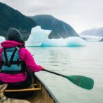 Jim Baird Instagram - Despite more rain, it was an incredible day on the Stikine River. We portaged the canoe over a mile to get into a remote lake only accessible by plane or boat. We paddled by mesmerizing icebergs and were in awe of the glaciers around the lake. In episode 12 of our adventure, @torigoesoutside and I finally paddled into Alaska, and found an off-grid salmon processing facility. Did we manage to get some fresh Stikine River sockeye salmon? Check out episode 12 of our adventure series on YouTube - link in bio! #outdoors #canoeing #alaskaadventures #northernbc #camping #familycamping #stikineriver #greatglscier #mountainsadventure #campingintherain
