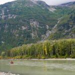Jim Baird Instagram - New video up! (Link in bio.). In this one, @torigoesoutside and I continue down Northern BC’s Stikine River towards Alaska with our family. We camp in a couple nice places where we need to put our tarp to good use because of the rain. Breaking camp in the morning takes a lot more time with kids as they need to be fed and dressed, (you can see me putting on Wesley’s wet suit on in one of the pics here). Both adults can’t really work at camp tasks at the same time because one of us needs to keep a watchful eye on our son Hudson who likes to go for hikes (with or without us!). Things get more challenging when we’re traveling down river and the rain really picks up…it just won’t let up for hours and hours on end and we’re soaked. Come evening, we begin searching for a cabin that should be close by. Our river notes are 30 years old so we don’t really know if it’s even there anymore. Soaked to the bone, at this point we’d be very grateful for a place to get warm and dry out tons of wet cloths. Do we find it? #alaska #jbadventurer #stikineriver #canoetrip #familycamping #outdoors #campwithkids #wilderness