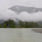 Jim Baird Instagram - New video up! (Link in bio.). In this one, @torigoesoutside and I continue down Northern BC’s Stikine River towards Alaska with our family. We camp in a couple nice places where we need to put our tarp to good use because of the rain. Breaking camp in the morning takes a lot more time with kids as they need to be fed and dressed, (you can see me putting on Wesley’s wet suit on in one of the pics here). Both adults can’t really work at camp tasks at the same time because one of us needs to keep a watchful eye on our son Hudson who likes to go for hikes (with or without us!). Things get more challenging when we’re traveling down river and the rain really picks up…it just won’t let up for hours and hours on end and we’re soaked. Come evening, we begin searching for a cabin that should be close by. Our river notes are 30 years old so we don’t really know if it’s even there anymore. Soaked to the bone, at this point we’d be very grateful for a place to get warm and dry out tons of wet cloths. Do we find it? #alaska #jbadventurer #stikineriver #canoetrip #familycamping #outdoors #campwithkids #wilderness