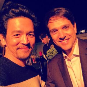 John Cho Instagram - This is me with @ralph_macchio. He plays Daniel LaRusso in a movie called Karate Kid, on which the show @cobrakaiseries is based. Season two is live now on @youtube.