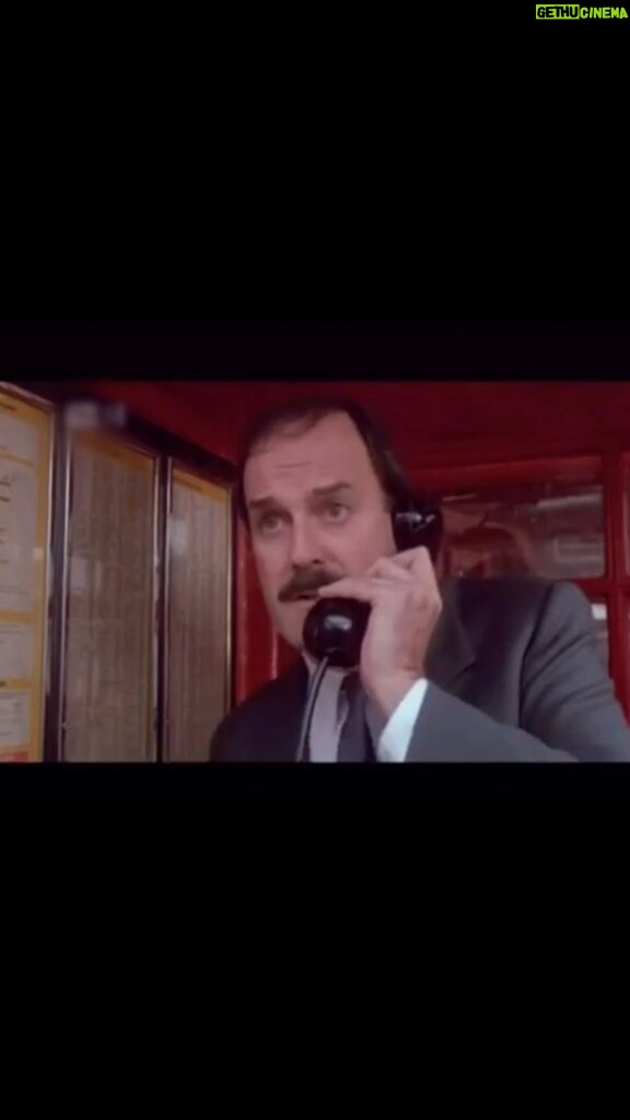 John Cleese Instagram - It’s eaten the money! from “Clockwise” ⏰ 1986 #80scomedy #80smovies #80smovie #headmasters #payphone #telephonebooth #telephonebox #phonebooth #runninglate #clockwise #redtelephonebox