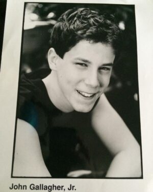 John Gallagher Jr. Instagram - I’m taking a cue from the GOAT @msmelanielynskey here. As you can see from this questionable old headshot (why the sleeveless tee?!) I’ve been working as an actor for a while now. I’m not exactly sure when I got my @sagaftra card but I was still a teenager so it must’ve been around the time this picture was taken. I’ve been extremely fortunate to work fairly steadily throughout my 23 years in this volatile and ever evolving industry. Work has been waining for me in the last few years though as it has been for many performers. A combination of factors including the pandemic, slowing momentum, plain old aging, changing trends, a pickiness about what roles I accept that I’ve been privileged enough to try and maintain and now this necessary but disruptive reckoning with the forces and factors of corporate greed that have slowly been eroding protections for the workers over the last decade. With so much at stake, not just for me but the entire profession, I feel the vital need to stand strong and proud in solidarity during this strike with my fellow actors/writers/creators and human beings who only wish to be paid fairly for their work and not be replaced by AI. It’s not an unreasonable ask. As the late, great Richard Manuel once sung, “I’m a union man now, all the way.” ✊🏻