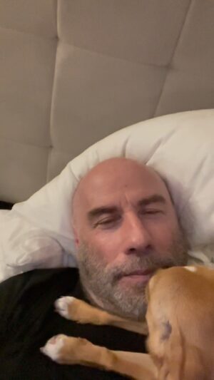 John Travolta Instagram - This is how Ben’s dog Peanut wakes me up.