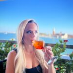 Julie Stewart-Binks Instagram - Italy, through the lens of my mom @georgiebinks 🍹🇮🇹 (I think she enjoyed the view 😂) @ricksteveseurope said I would “draw approving looks from locals if I ordered spritz con aperol,” and I took that personally 🫡 #italy #venice #rome #positano #aperolspritz #aperoltime