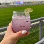 Julie Stewart-Binks Instagram – Thanks @woodbinetb for inviting my family to the first “King’s Plate” since 1951. The last few years, we’ve been watching from home and getting creative 🐴 But today was so special to witness it in person! 

Huge thank you to @daviddunkleyhat for the beautiful fascinator to complete my look – this dress was my grandma’s, the lovely Jean Binks ❤️ 

#kingsplate #woodbineracetrack #andtheyreoff #paramountprince #horseracing #canadiantriplecrown  #queensplate Woodbine Racetrack