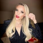 Julie Stewart-Binks Instagram - I don’t sled I slay 🎶🛷 ❤️ @todrick #bellsbowsgiftstrees #holiday #holidayszn #holidayoutfit #redlips Manhattan, New York