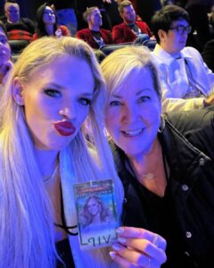 Julie Stewart-Binks Instagram - In my festive era 🎄🪩❄️ #decembertoremember #carrottop #vegas #pokerface #mariahcarey #madonna #vip #skating #christmaspartyszn #thecanuck #hockey #redtights #offair