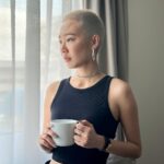 Julie Tan Instagram - Flaunting my fresh blonde buzzcut and pretending this cup isn’t just a prop to show off my nails. 🤫 Singapore