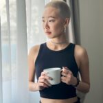 Julie Tan Instagram - Flaunting my fresh blonde buzzcut and pretending this cup isn’t just a prop to show off my nails. 🤫 Singapore