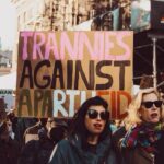 Justin Vivian Bond Instagram - Trans Awareness Week We weren’t aware that sign was behind us or that we were being photographed at the Queer Solidarity March yesterday but we aren’t mad at it. Sending love and solidarity to all my trans siblings from the US to Gaza, Ukraine and throughout the world who are fighting and living bravely despite anti-trans laws, injustice, wreckless patriarchal violence, extremist ideologies, gender essentialism, and genocide. We always have and always will prevail. #glamourisresistance #transawarenessweek #ceasefirenow #transisbeautiful 🩷🤍🩵 Photo: @alexabwilkinson