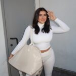 Kalani Hilliker Instagram - Travel in style this holiday season with the perfect Karry-All Bag 🎄🤍 last 3 days of the 12 days of Christmas 30% off site wide sale! Shop @karebykalani and use code HOLIDAYCHEER🧖🏼‍♀️💋✨