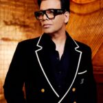Karan Johar Instagram - I did my best to keep it as simple and classic this season! Ofcourse I succumbed to some sheen and some drama but a leopard can’t change its spots it can just rearrange them! This is our attempted sober look by @ekalakhani and @maisonvalentino 📷 @kevin.nunes.photography for #koffewithkaran season8 thanks for making us rate!