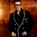 Karan Johar Instagram - I did my best to keep it as simple and classic this season! Ofcourse I succumbed to some sheen and some drama but a leopard can’t change its spots it can just rearrange them! This is our attempted sober look by @ekalakhani and @maisonvalentino 📷 @kevin.nunes.photography for #koffewithkaran season8 thanks for making us rate!
