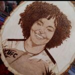 Karine Silva Instagram - Repost from @arials_art @ufcslabs • My best yet!!! @karine_killer_ufc ! Three days, many hours and finally complete!! 🔥👌 ******************** I have no words to describe happiness for all this affection. Thank you Não tenho palavras para descrever a felicidade por todo esse carinho. Obrigado #killer #teamsilva #brazil🇧🇷 #woodburning #woodburningart #woodburningartist #art #artpiece #pyrography #pyrographyart #karinekiller #killerkarine #ufc