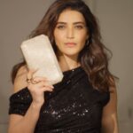 Karishma Tanna Instagram - Dazzling in the spotlight, @karishmaktanna elevates her party glam with the enchanting Caprese Festive Clutches! Explore this curated collection, perfectly styled for every celebration. From her hands to yours, embrace the festive season in true fashionista style. Our exclusive collection of festive clutches by Caprese is your ticket to glamorous festivities. OFFER ALERT: Shop Caprese Bags worth Rs. 3999 and get a FREE movie voucher worth Rs. 600. #Caprese #CapreseGirl #TheFestiveEdit #FestiveVibes #EleganceUnleashed #CapreseClutches #FestiveFashion #PartySeason #CapreseGlam #Clutches