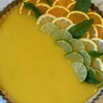 Kate Hudson Instagram - A Sicilian Lemon Tart featuring the limited-edition spatula I designed with Rani Rose for @nokidhungry x @williamssonoma! 🍋💛 Help end childhood hunger in America by purchasing one using the link in my bio. Each spatula purchased can help provide 40 meals for kids and teens! Recipe below👇 Crust: 1/4 cup olive oil 1 1/2 Tbsp Ground Almonds 1 1/4 cup all-purpose flour 1/4 vanilla bean sea salt 1 egg yolk Custard: Juice of 3 lemons Zest of 1 lemon 6 oz. Cane sugar 2 Tsp cornstarch 2 egg yolks 2 whole eggs 2 oz of unsalted butter, cubed 2 Tbsp olive oil 1. Mix all ingredients for the crust in a bowl. Should be crumbly, but come together, 2. Press into the tart pan and bake at 350F for 15 mins. Let cool while you work on the custard. 3. Combine all ingredients for the custard in a medium sauce pan, EXCEPT FOR olive oil and butter, on medium heat. Stir until thickened. 4. Remove mixture from heat then stir in olive oil and butter until melted. 5. Pour the custard mixture onto the tart crust. 6. Refrigerate for 2-3 hours. Garnish with fresh citrus and mint.
