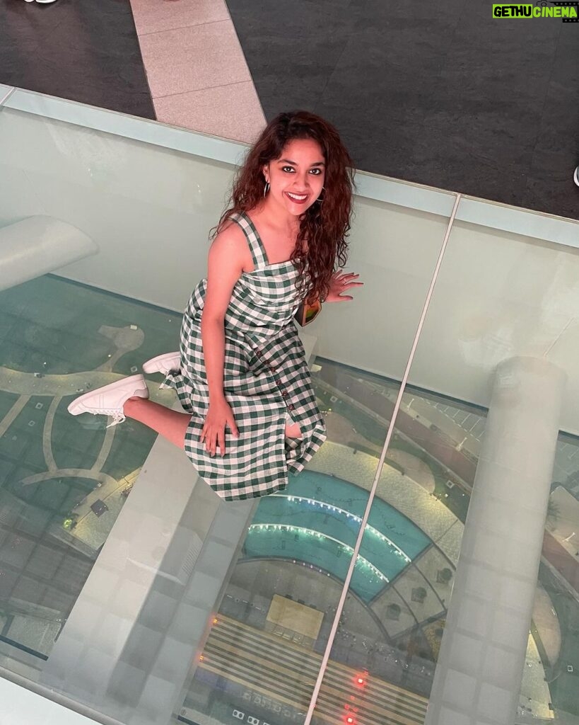 Keerthy Suresh Instagram - Kitty with a Kitty Bun! 🐱 Also, Duh! I am not scared of heights! 👀 #random #throwback #dubaidiaries